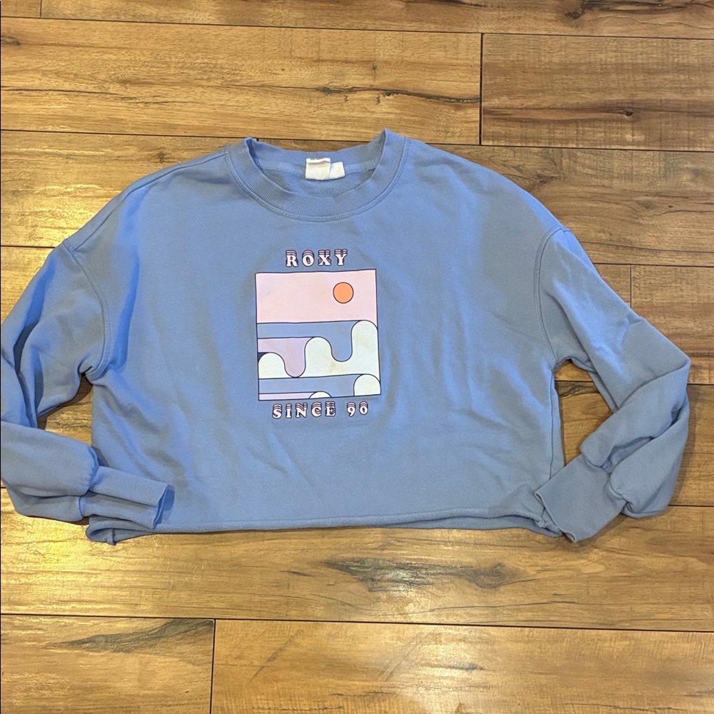 Roxy Pastel Blue Cropped Graphic Sweatshirt with Pink Accent Surf Adventure